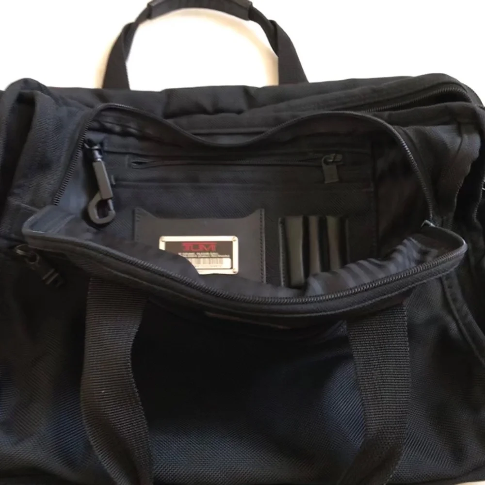 Tumi Black expandable laptop bag. clean interior. Work, travel, Classic
